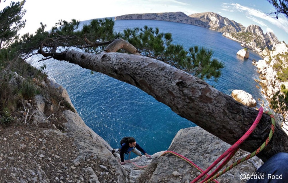 Rock climbing on famous limestones cliffs of Calanques in Marseille city